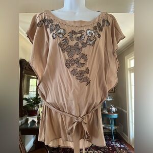 bebe blush-colored blouse with tied belt, silk with beads and cutout work.